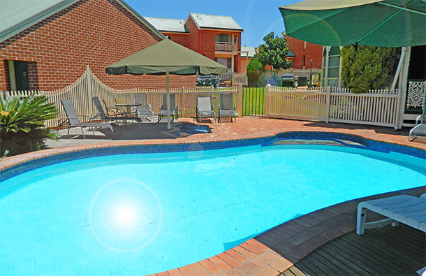 Relax by the pool at The Roseville Apartments